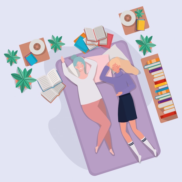 Mujeres jóvenes relajándose en un colchón en el dormitorio
