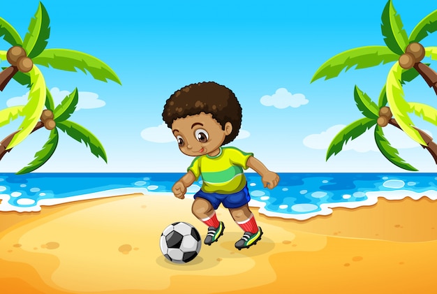 Un niño jugando al fútbol en la playa.