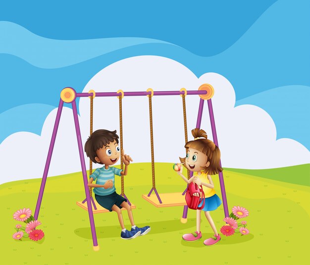 Un niño y una niña en el patio de recreo.