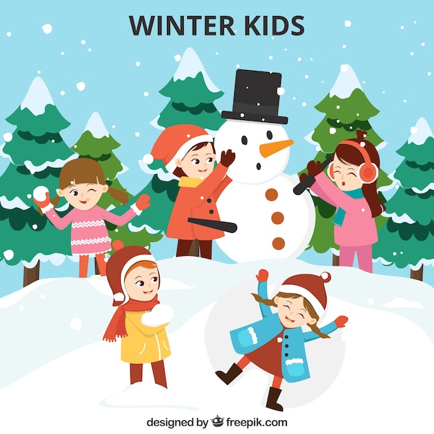 Niños divirtiéndose en invierno al aire libre
