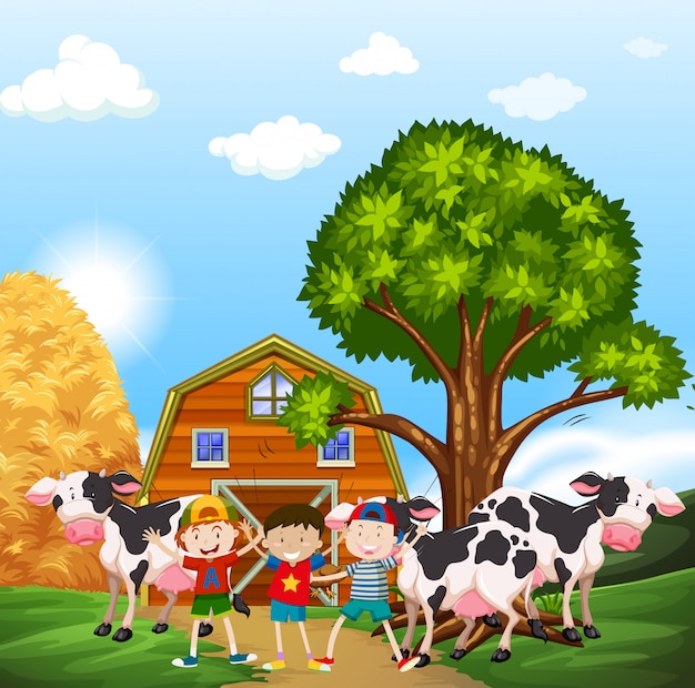 Niños y vacas en el corral.