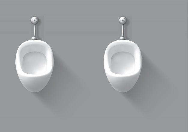 Orinal de cerámica blanca en la pared en el baño masculino