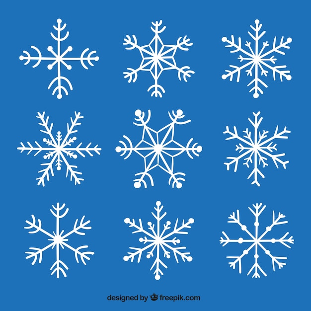 Vector gratuito pack de copos de nieve decorativos dibujados a mano