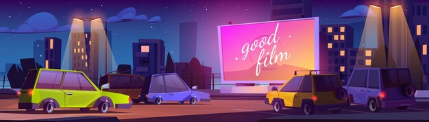 Pantalla de cine al aire libre en el estacionamiento por la noche
