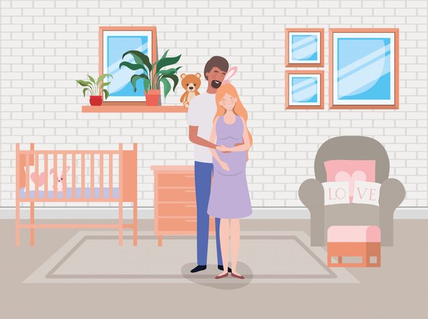 Pareja de embarazo en la escena de la habitación del bebé