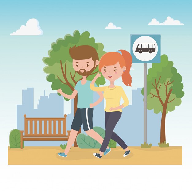 Pareja joven caminando en los personajes del parque