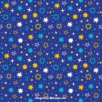 Patrón azul oscuro con variedad de estrellas dibujadas a mano