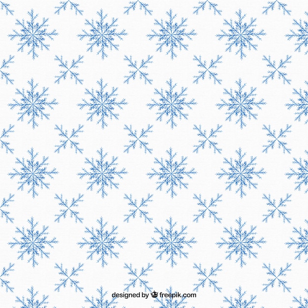 Patrón dibujado a mano con copos de nieve ornamentales