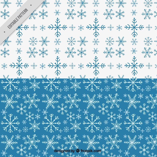 Vector gratuito patrones azules y blancos con copos de nieve