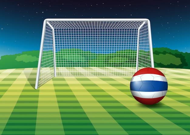 Una pelota en el campo con la bandera de Tailandia