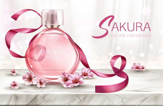 Perfume, producto cosmético en botella de vidrio con encaje y flores de sakura rosa.