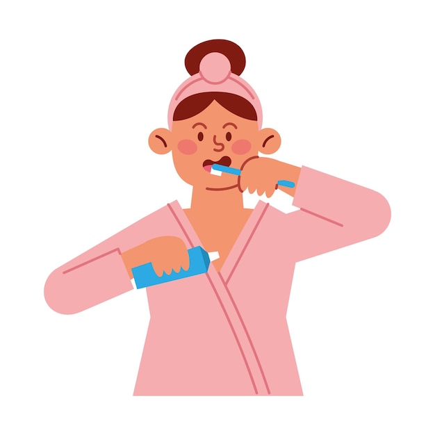 persona cepillándose los dientes con bata de baño