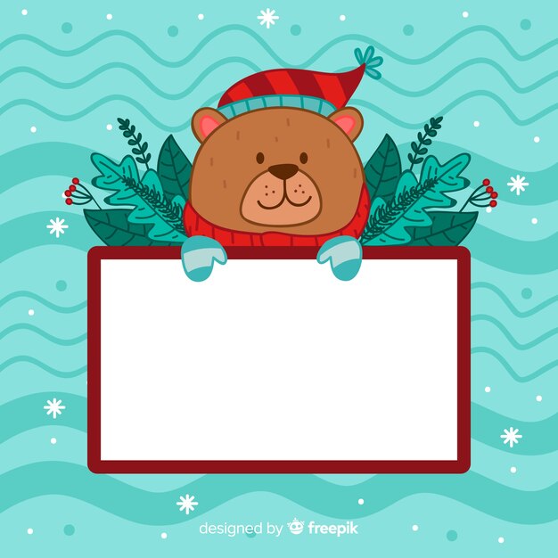 Personaje de navidad con una tarjeta blanca
