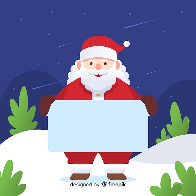 Personaje de navidad con una tarjeta de navidad