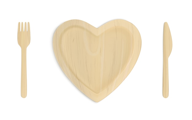 Plato corazón de madera con tenedor y cuchillo