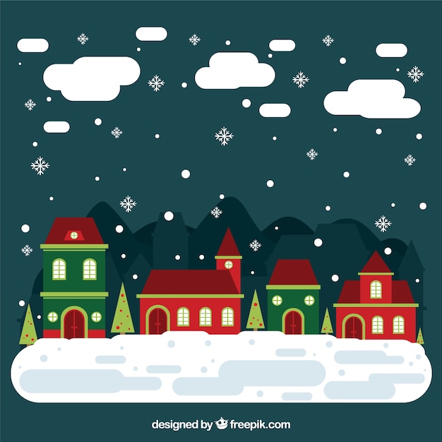 Vector gratuito pueblo navideño nevado en diseño plano