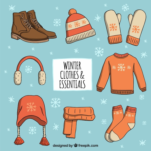 Ropa de invierno dibujada a mano y elementos esenciales