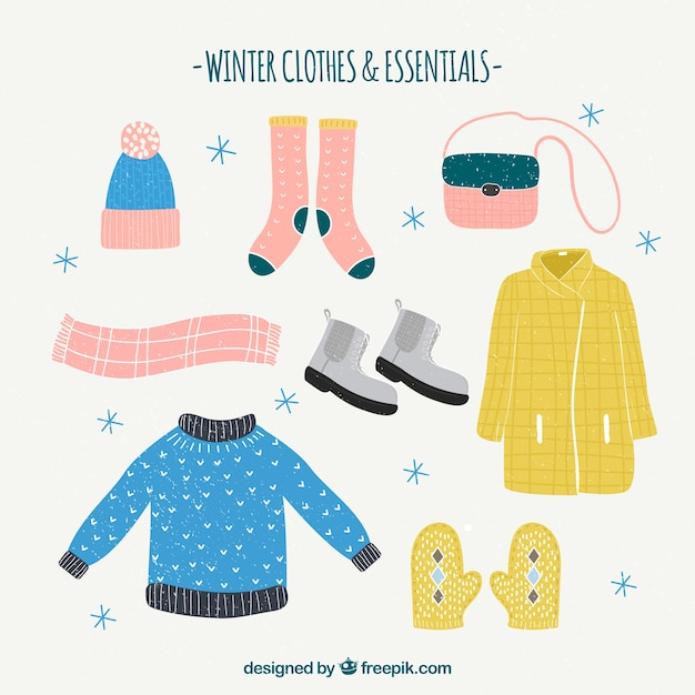 Ropa de invierno dibujada a mano y elementos esenciales