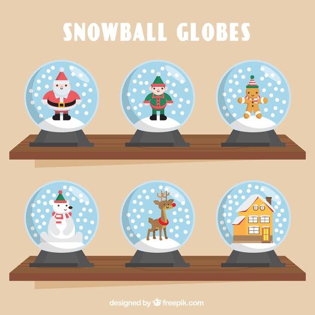 Seis bolas de nieve con elementos navideños 