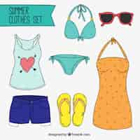 Vector gratuito set de ropa de playa dibujada a mano