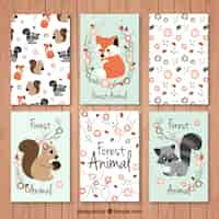 Vector gratuito set de tarjetas de bonitos animales del bosque con detalles florales