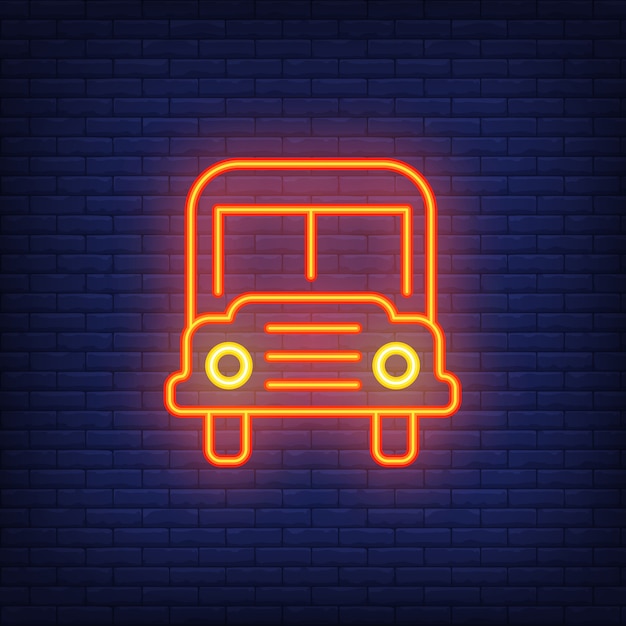 Vector gratuito signo de neón del autobús escolar. moderno autobús escolar naranja con faros.