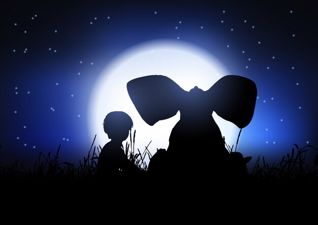 Silueta de un niño y un elefante recortada contra el cielo nocturno