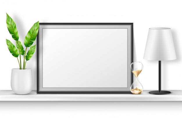Soporte de marco de fotos vacío en estante blanco con planta