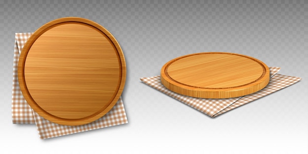 Tablas de madera para pizza sobre paños de cocina