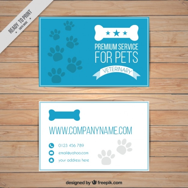 Vector gratuito tarjeta azul de mascotas con huellas y hueso