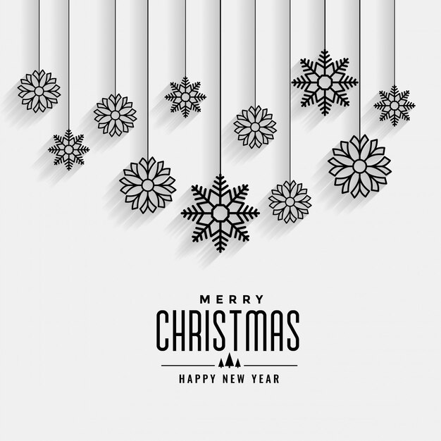 Tarjeta blanca de feliz navidad con diseño de copos de nieve colgantes