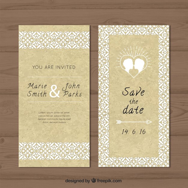 tarjeta de boda ornamental con una pareja besándose