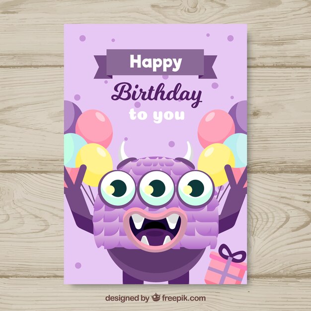 Tarjeta de cumpleaños con monstruo divertido en estilo plano