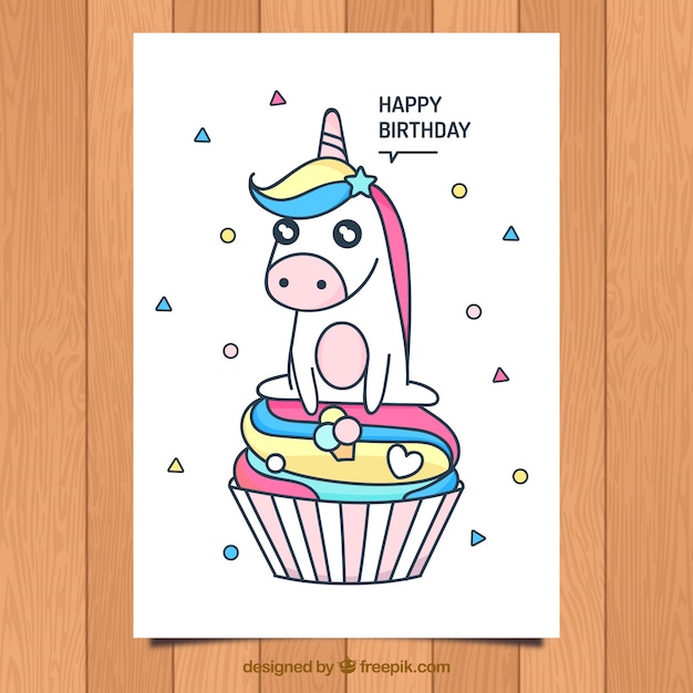 Tarjeta de cumpleaños con unicornio tierno y cupcake