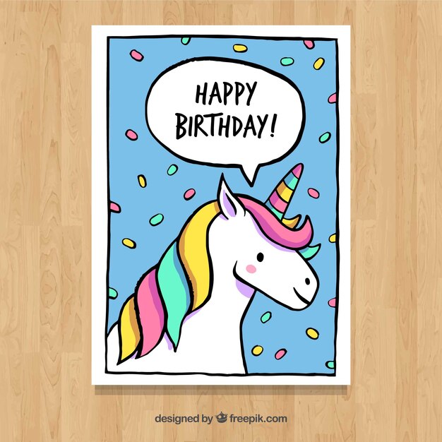 Tarjeta de felicitación con unicornio y confeti