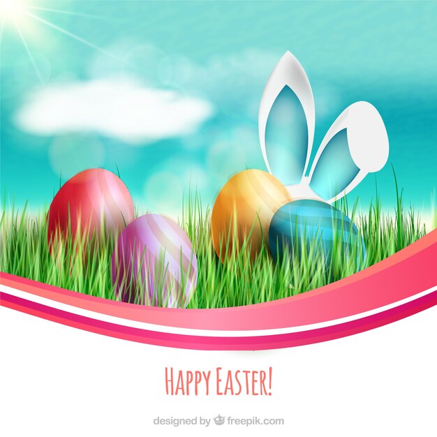 Tarjeta de Pascua con huevos de colores y orejas de conejo