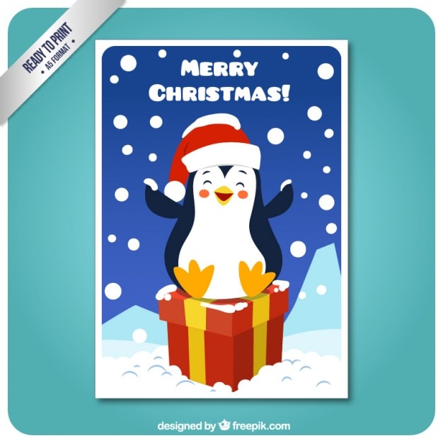 Vector gratuito tarjeta de pingüino sonriendo sobre un regalo