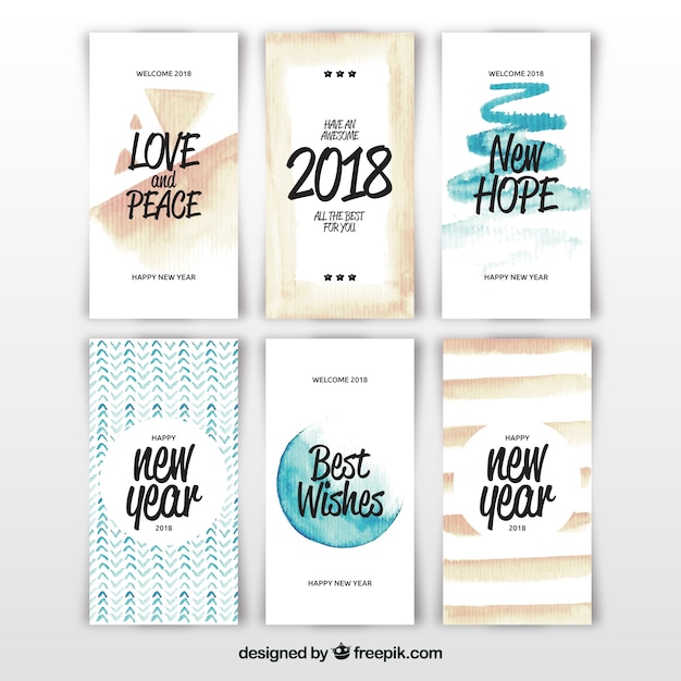 Vector gratuito tarjetas de año nuevo 2018 en acuarela con lettering