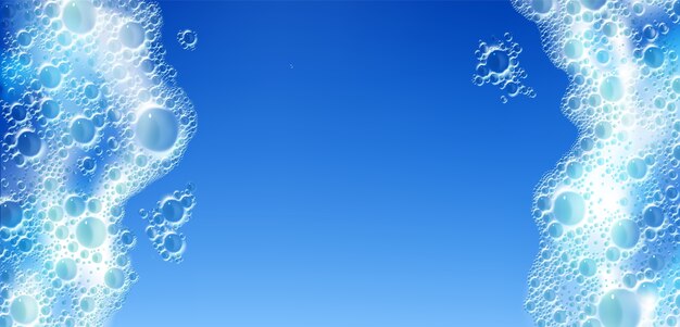 Textura de espuma de jabón aislado sobre fondo azul.