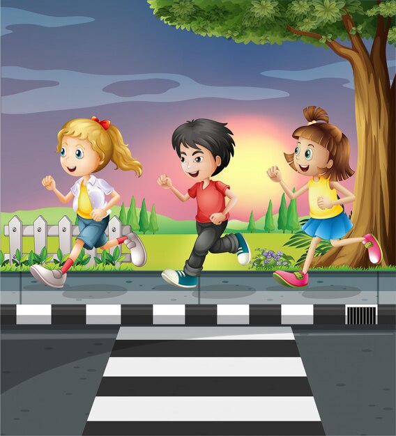 Tres niños corriendo por el camino