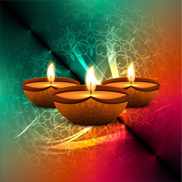 Tres velas sobre un fondo colorido para diwali