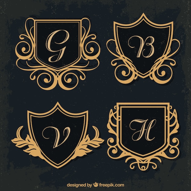 Varios monogramas dorados de escudo