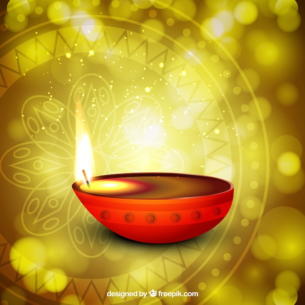 Vector gratuito vela de diwali sobre un fondo brillante