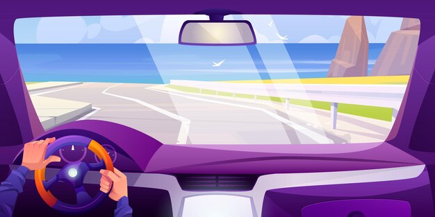 Vista de la playa del mar desde el interior del coche a través del parabrisas del vehículo