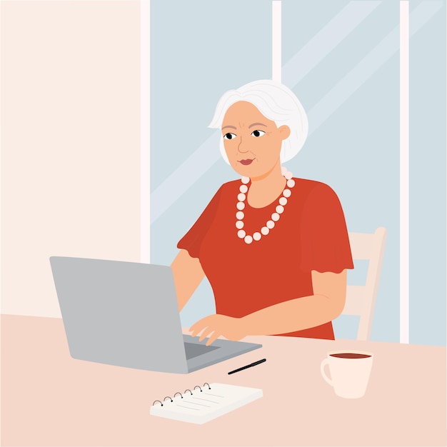 Una abuela de negocios con una computadora portátil Una anciana feliz trabaja se comunica mira videos
