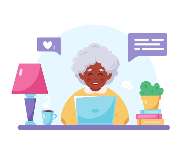 Abuela sentada con laptop Anciana negra usando computadora