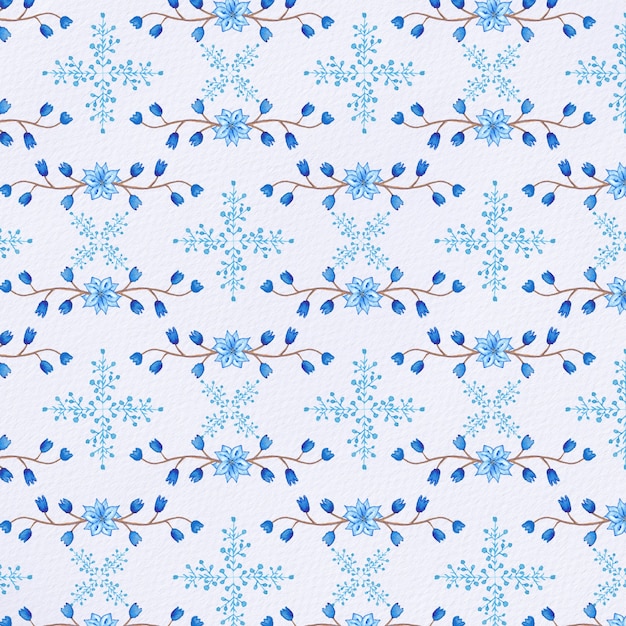Acuarela de Navidad / fondo con flores azules y copos de nieve