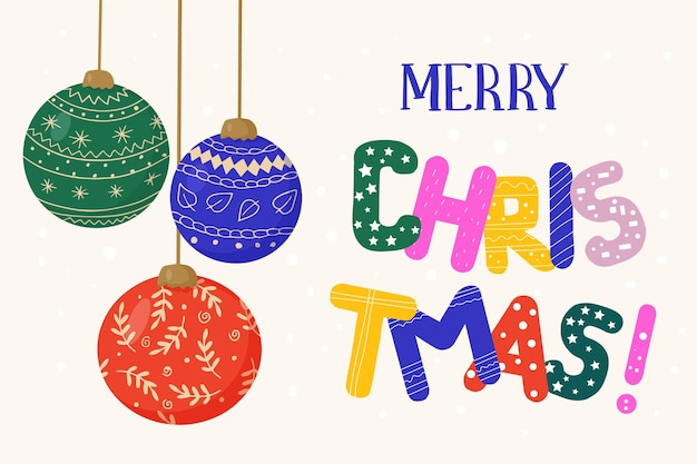 Adornos para árboles de Navidad hechos de bolas de cristal e inscripción de saludo en letras brillantes