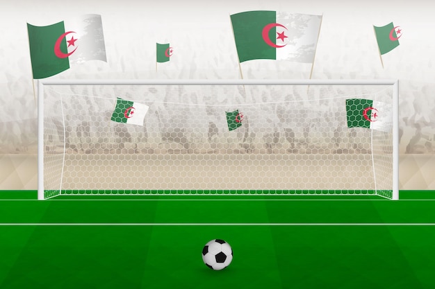 Aficionados del equipo de fútbol de Argelia con banderas de Argelia animando el concepto de tiro penal del estadio en un partido de fútbol