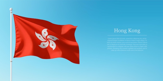 Agitando la bandera de Hong Kong contra el cielo azul claro Copyspace